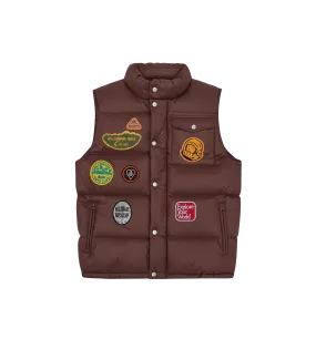 Brown down filled gilet with patches.