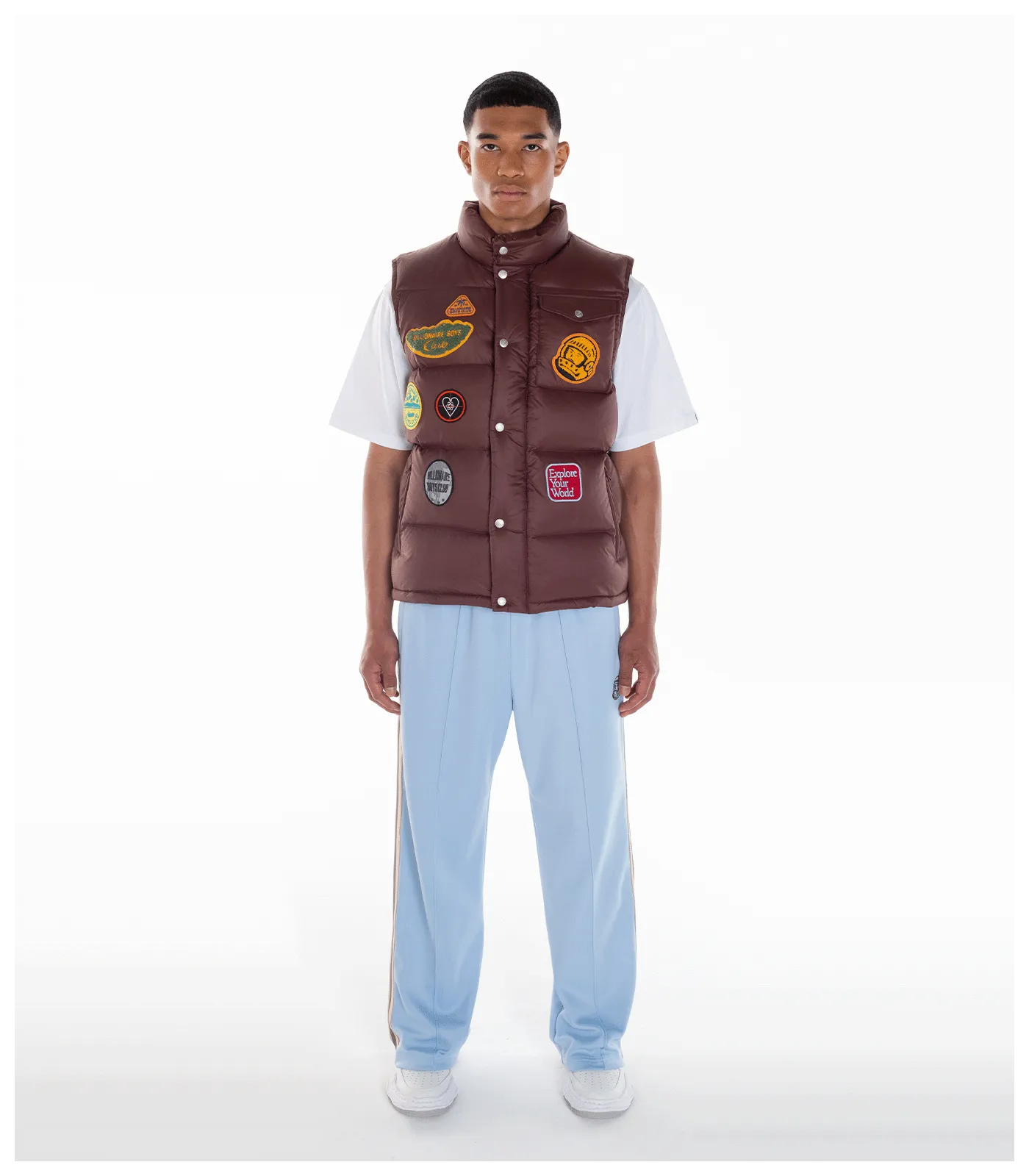 Brown down filled gilet with patches.