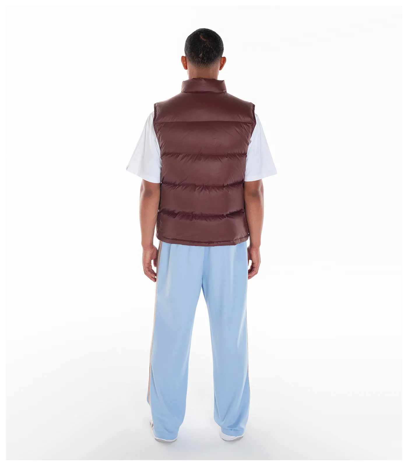 Brown down filled gilet with patches.