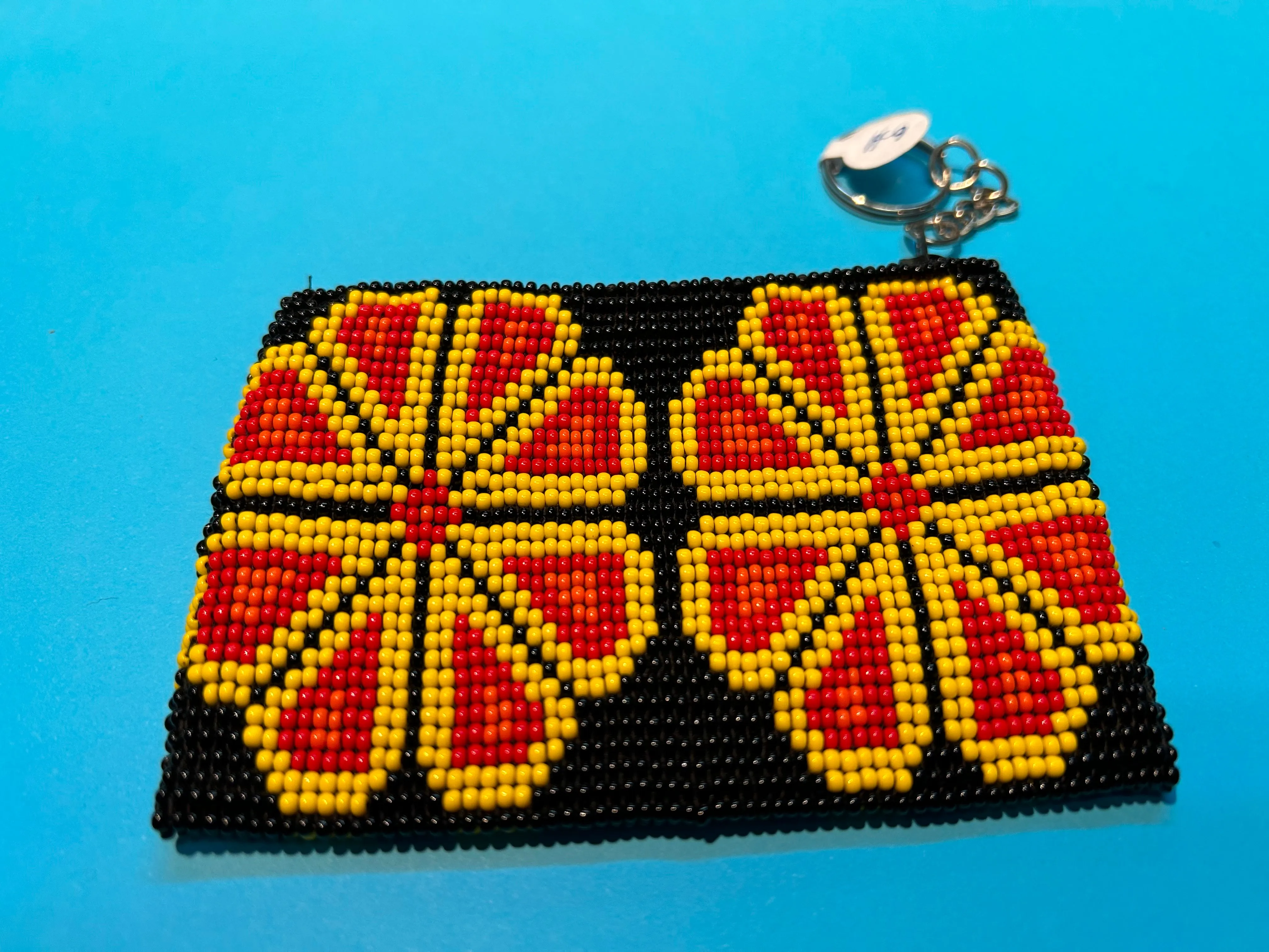 Guatemalan handcrafted glass bead change purse in intricate designs.