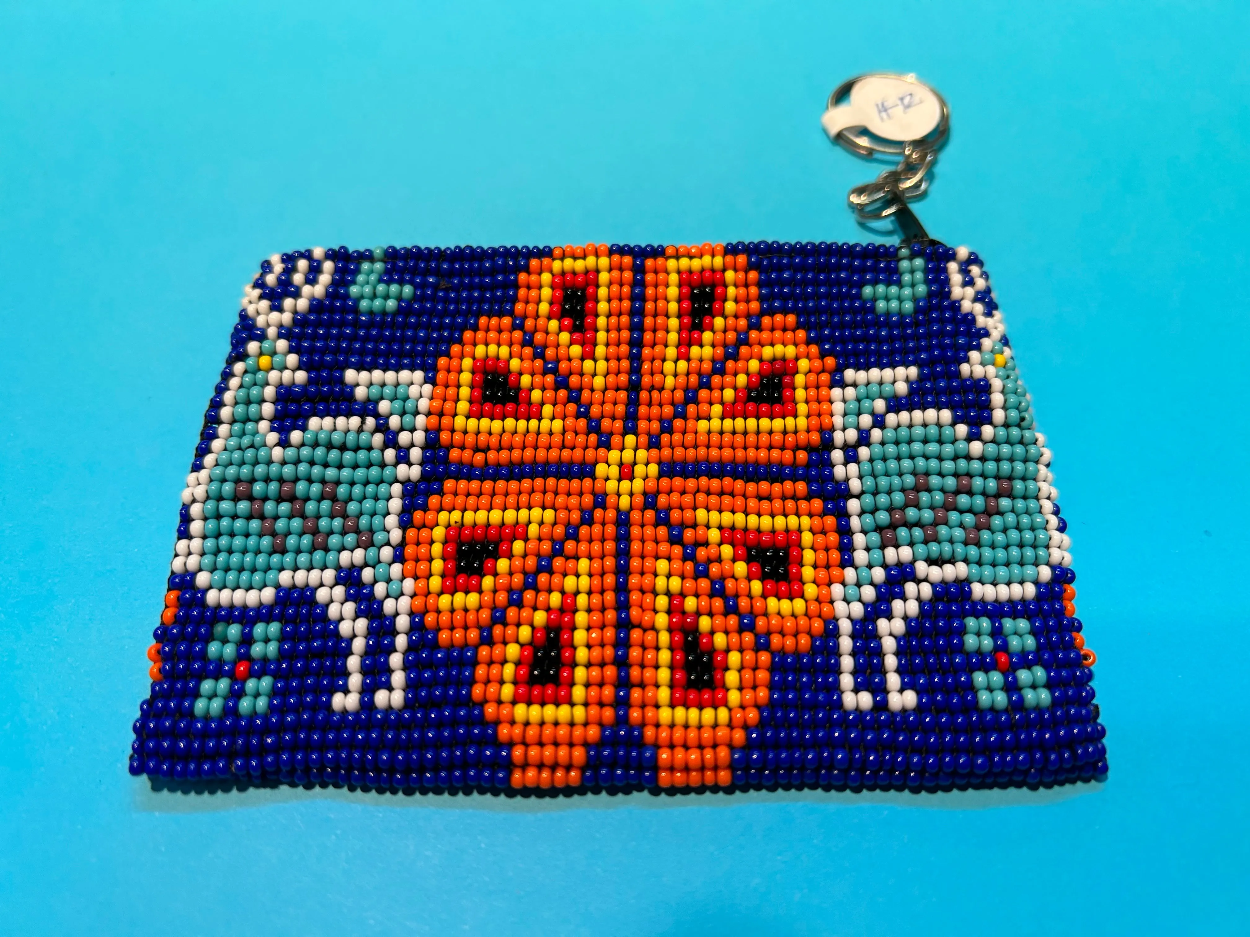 Guatemalan handcrafted glass bead change purse in intricate designs.