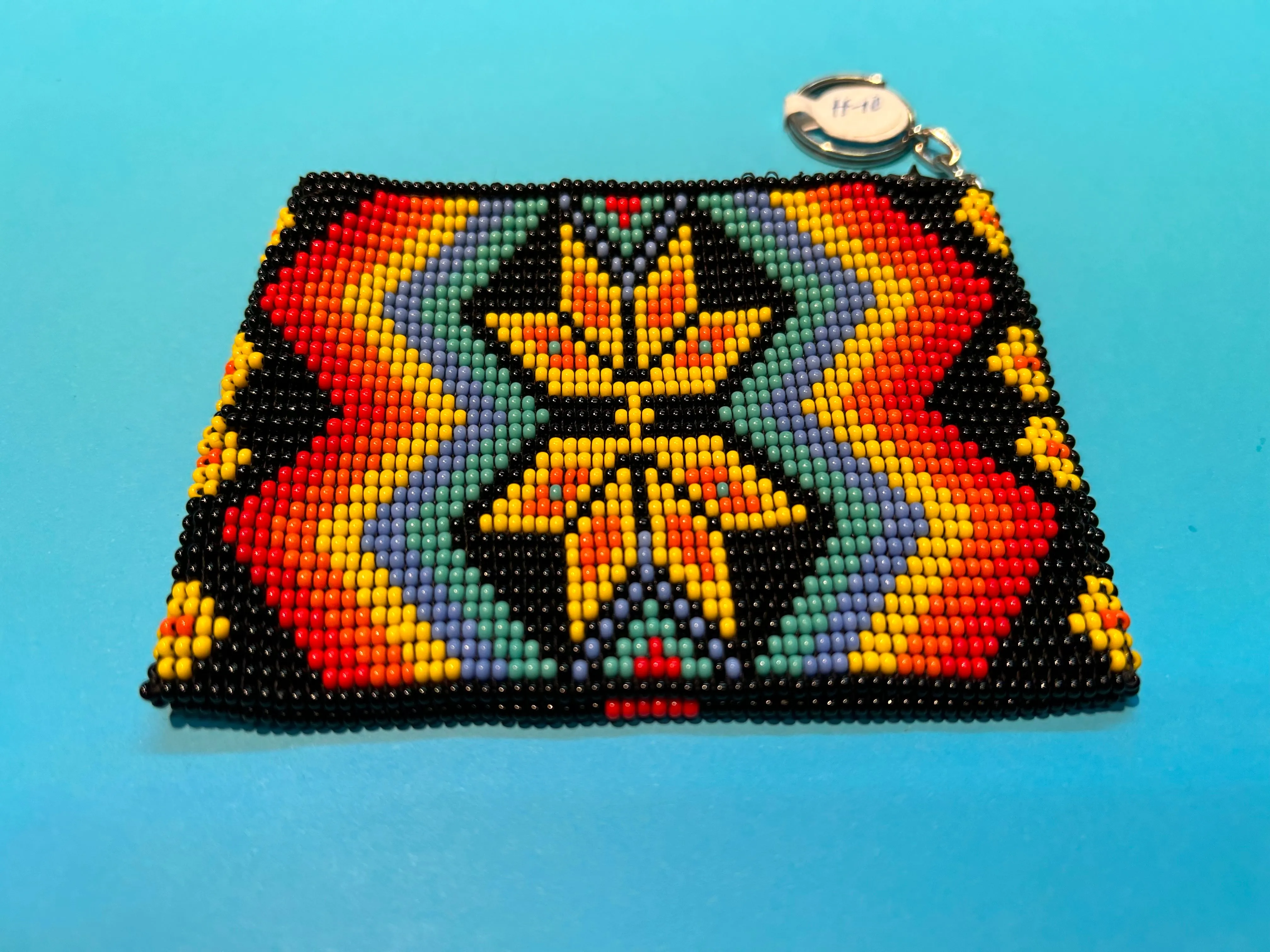 Guatemalan handcrafted glass bead change purse in intricate designs.