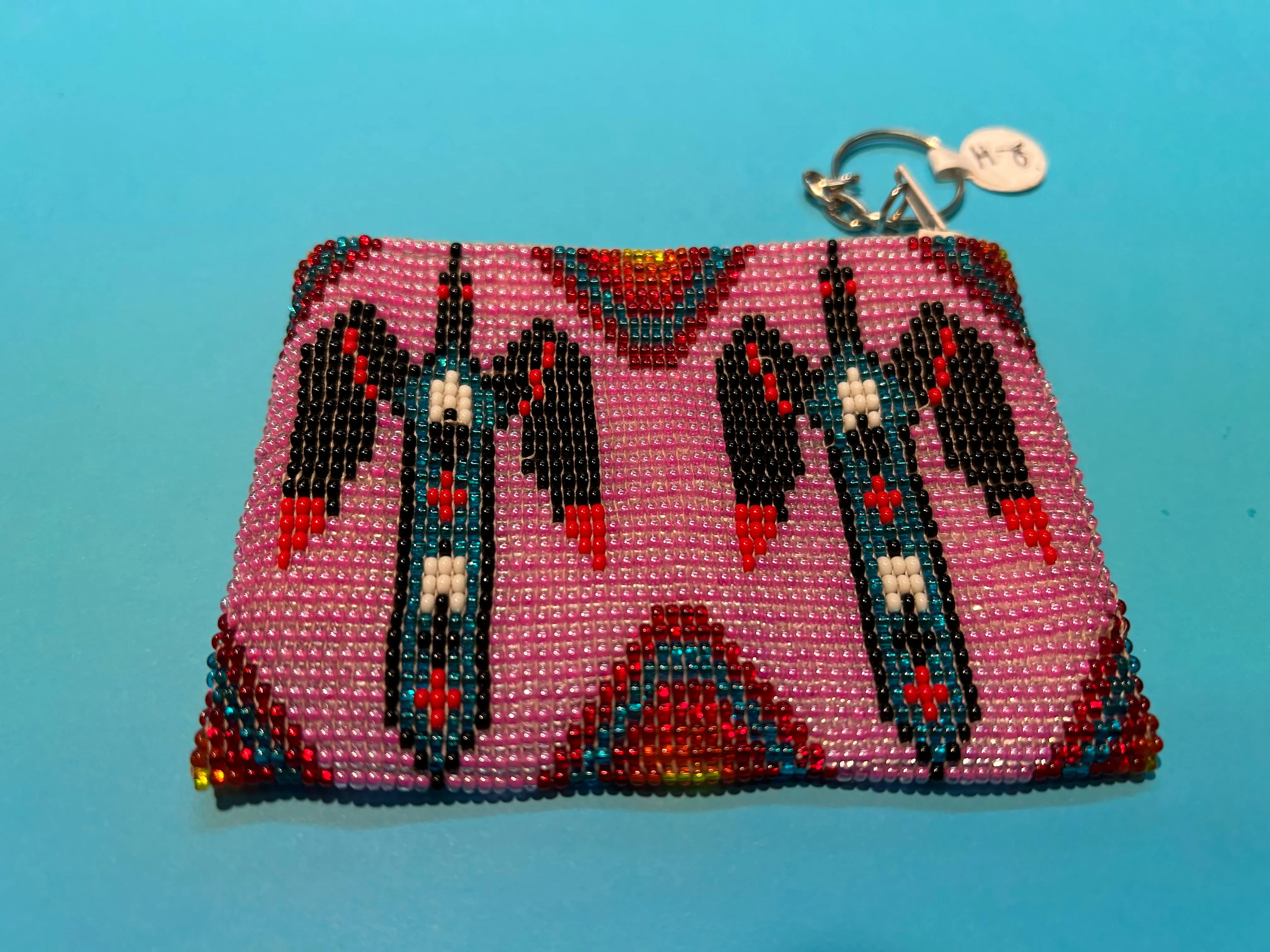 Guatemalan handcrafted glass bead change purse in intricate designs.