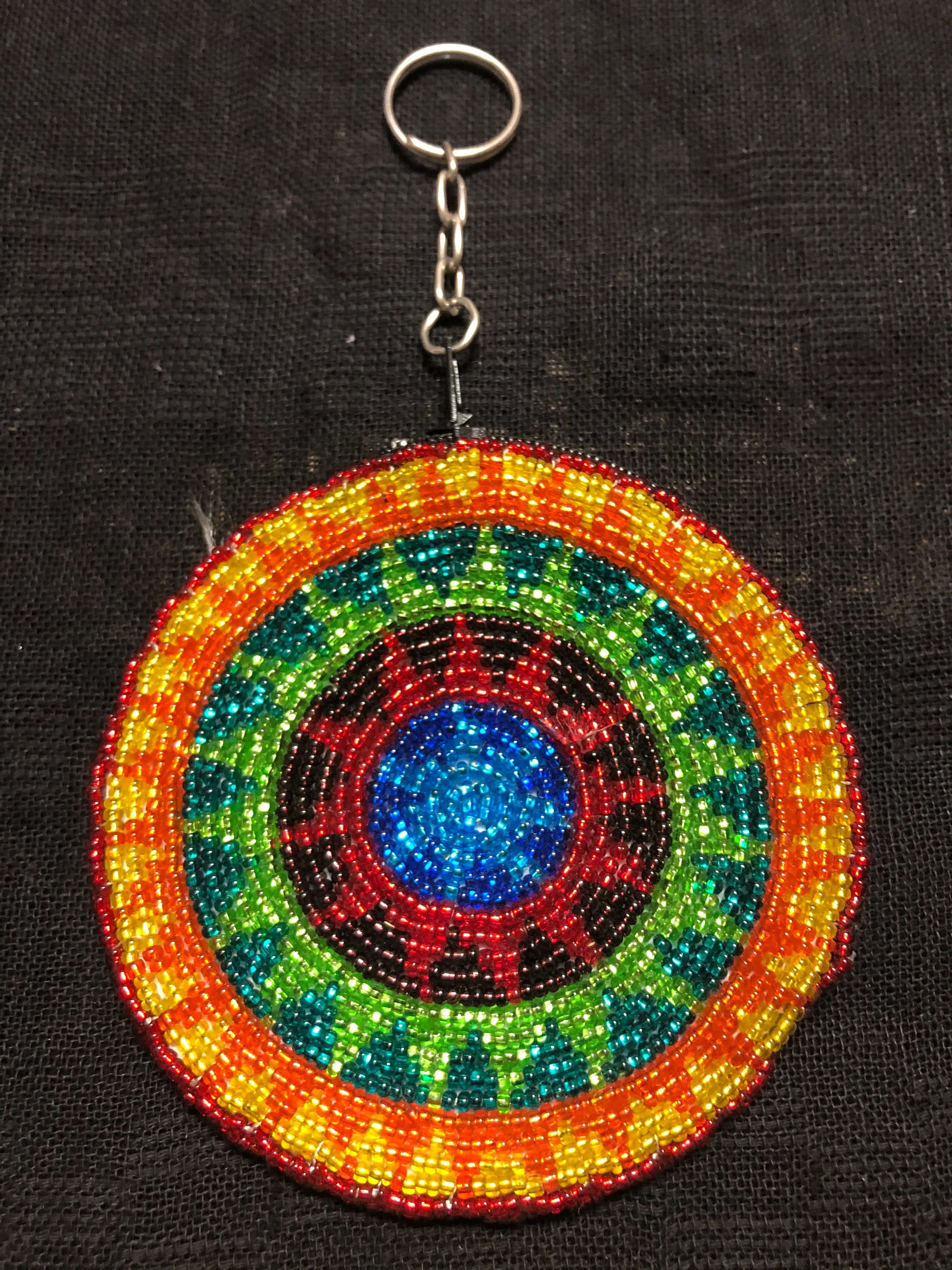 Guatemalan handcrafted glass bead round change purse with key ring. 3.5” diameter.