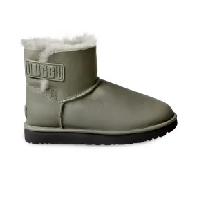 UGG Mini Bailey boots - Women's in ultra matte seaweed with logo strap.