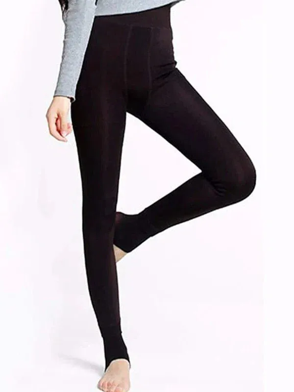 Winter women's fleece-lined leggings with side pockets.